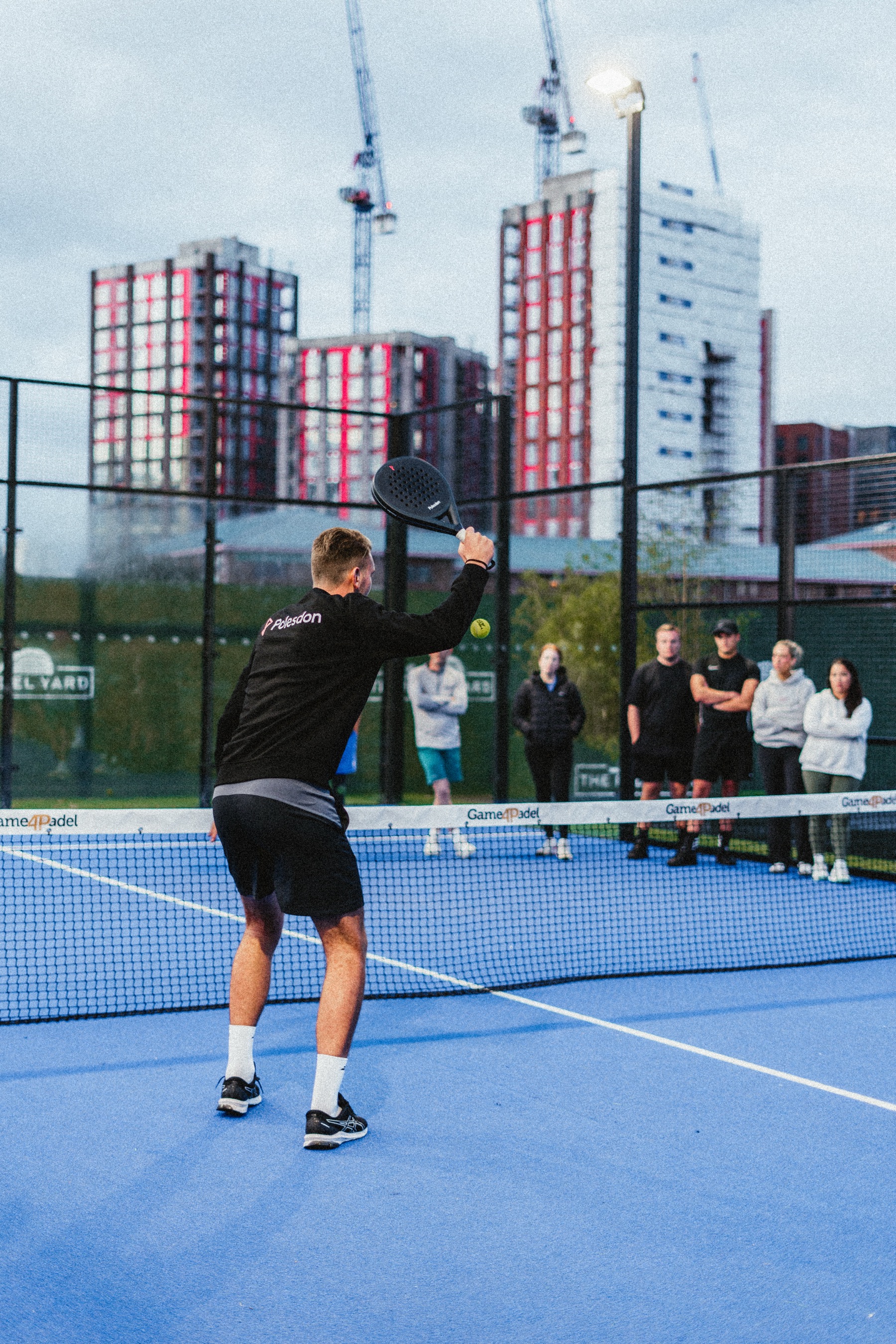 Player serving on a London court